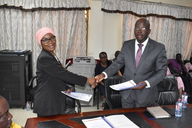 MAD. AFI YAKUBU HANDS OVER TO MR. SAMUEL WILLIAMS YEBOAH THE NEW EXECUTIVE SECRETARY OF THE SMALL ARMS COMMISSION